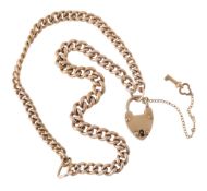 A double curb link bracelet, the graduated curb links to a heart shaped...  A double curb link