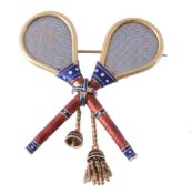 An enamelled gold double tennis racquet brooch , circa 1870  An enamelled gold double tennis racquet