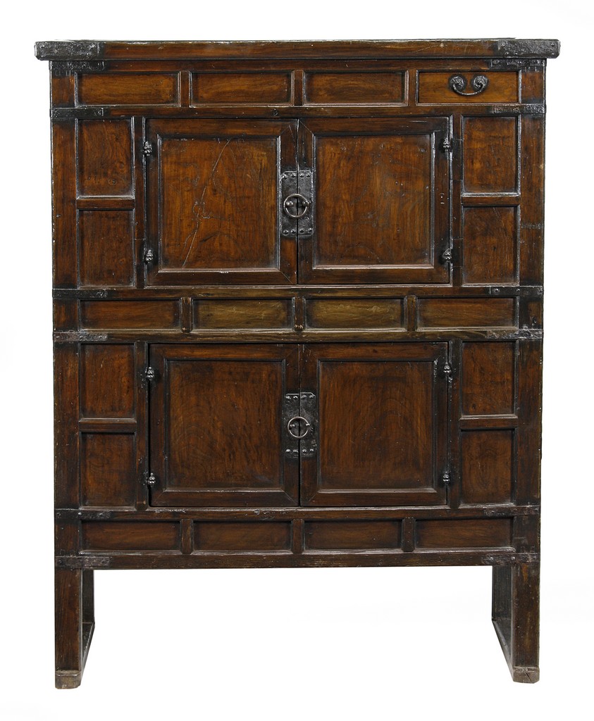 A Chinese elm and pine cabinet, 19th century, with iron mounts throughout, the four panelled