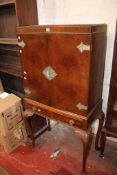 A Waring & Gillows style walnut cocktail cabinet 154 high, 85cm wide. There is no condition report