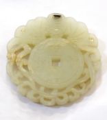 A Chinese pale jade disk, with pierced scrolling decoration and character marks, 5.5cm diameter.