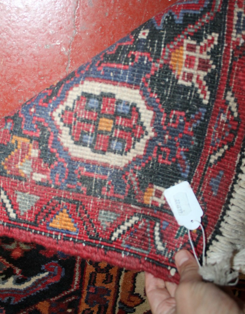 A Middle Eastern rug with red ground and central lozenge medallion 330 x 245cm - Image 2 of 2