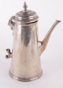 A silver straight tapered coffee pot by Spink & Son, London 1973, with a bell shaped finial and a