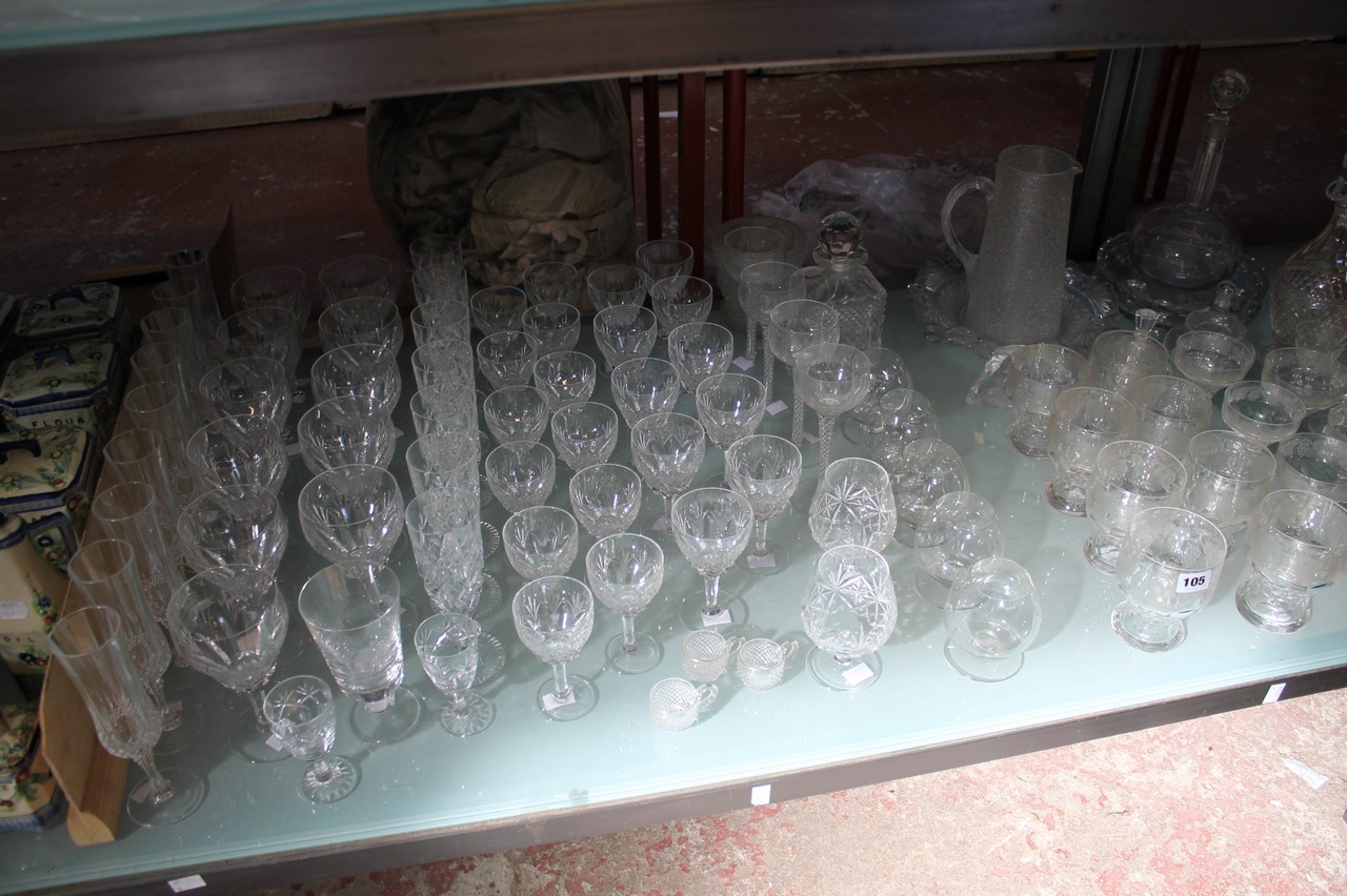 A large quantity of glassware, champagne flutes, wine and brandy glasses etc. There is no