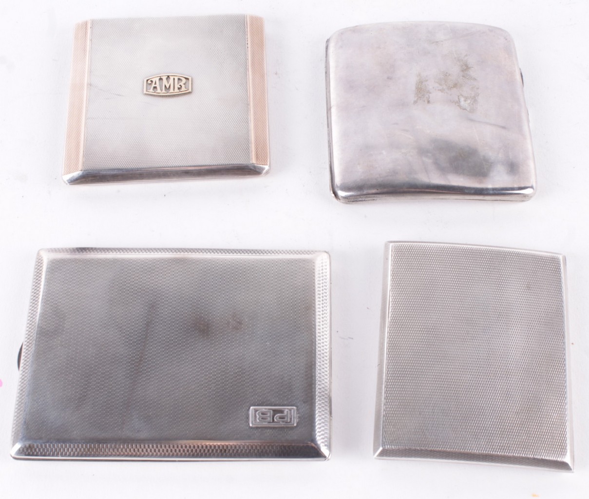 Four silver cigarette cases, to include: a rectangular square sliding cigarette case, maker`s