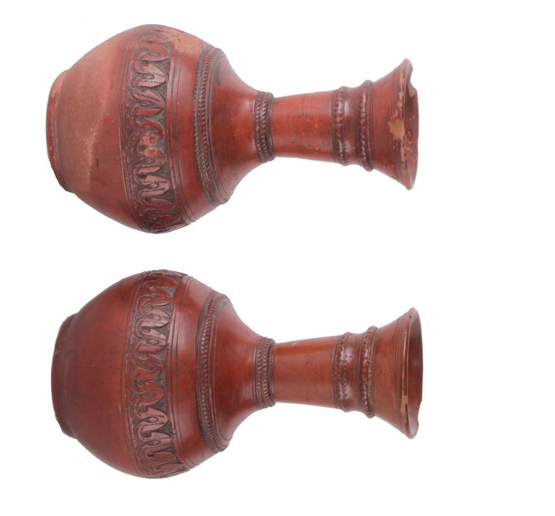 A pair of terracotta vases, of globular shape, 22cm high. There is no condition report available