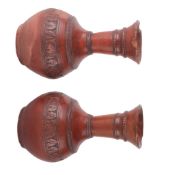 A pair of terracotta vases, of globular shape, 22cm high. There is no condition report available