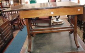 A Sheraton Revival style mahogany sofa table with swag decoration to the frieze. There is no