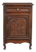 A Louis XV provincial oak cupboard with a lifting lid, drawer and cupboard below 116cm high, 80.