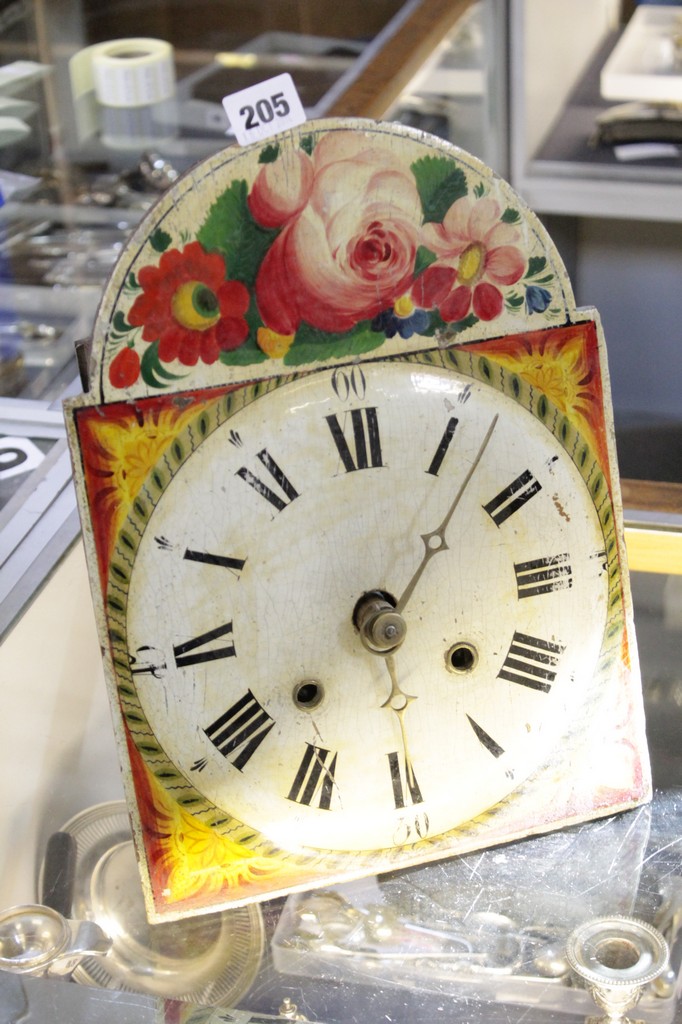 A Continental enamel dial and painted wall clock, with pendulum and weights. There is no condition