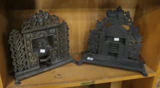 A miniature cast iron fire surround with heraldic crest, and another similar stamped `Ballard and