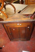A George III oak corner cupboard plus a 19th century mahogany commode stool. There is no condition