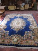 A blue ground Chinese floral decorated carpet 360 x 475cm