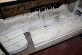A simulated marble plaster fire surround 145cm high,113cm wide. A condition report is not