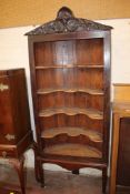 An arched back open cupboard on stand, 19th century 198cm high, 97cm wide. There is no condition