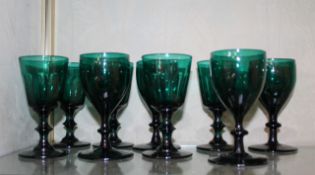 Nine assorted 19th century green glass wine glasses. There is no condition report available on