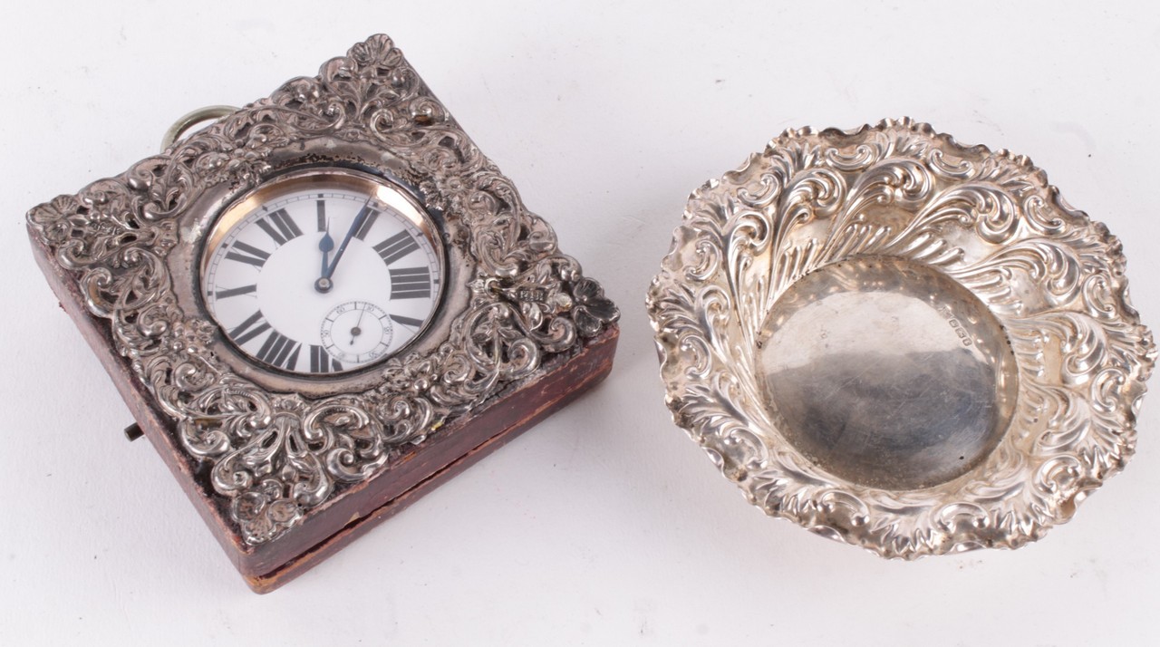 An Edwardian silver mounted travelling clock case by Henry Matthews, Birmingham 1901, embossed