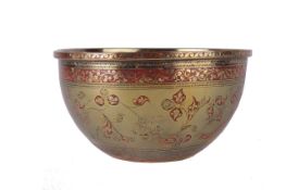 An Indian brass bowl, with floral decoration and red enamel, 12.5cm diameter. There is no