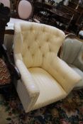 A Victorian mahogany and upholstered armchair.