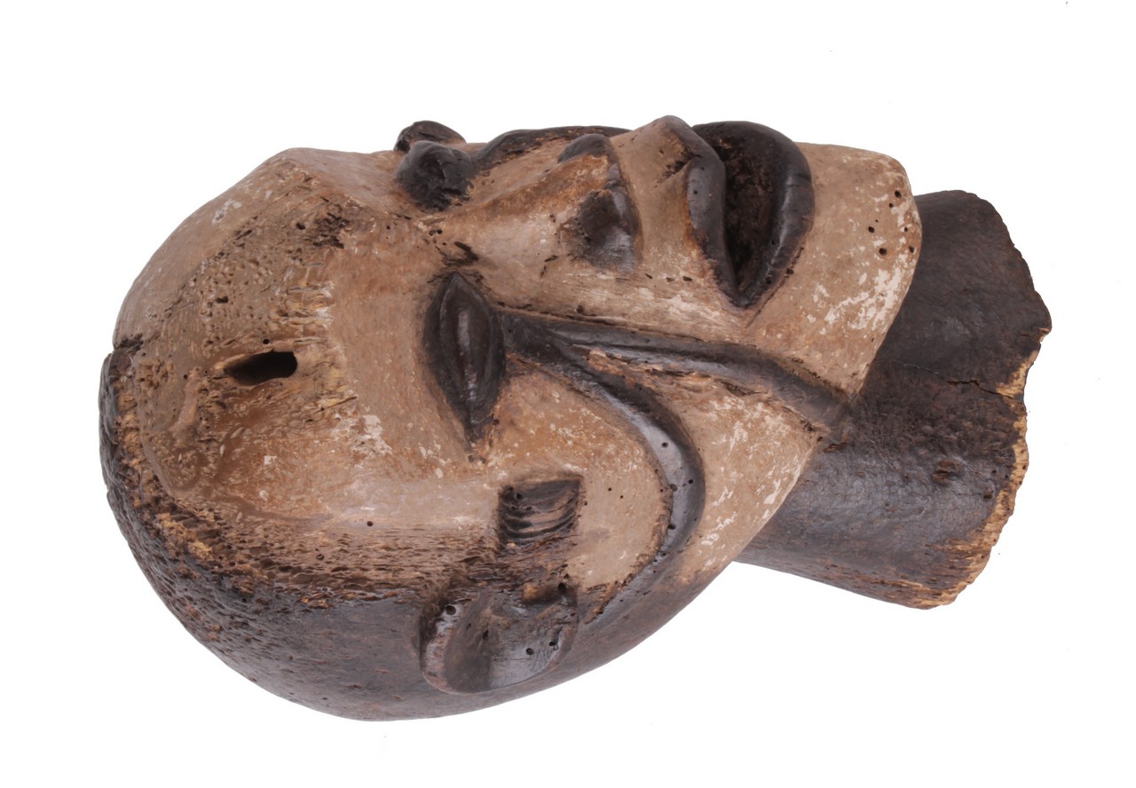 An African tribal carved mask, Nigeria, Ibibo region, 30cm high. There is no condition report