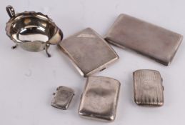 Four various silver cigarette cases, 20th century makers and dates; an Edwardian engraved vesta