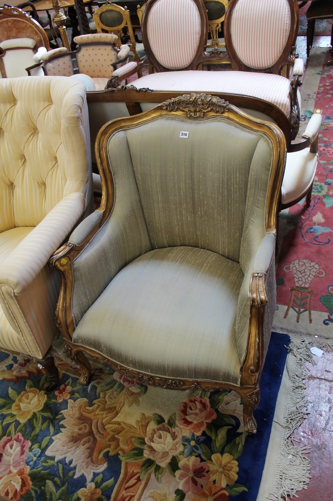 A Louis XV style gilt and upholstered armchair