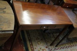 A 19th Century mahogany tea table on square section tapering legs 91cm wide