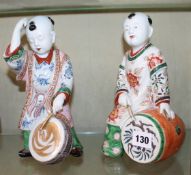 A pair of Japanese porcelain figures of drummer boys. There is no condition report available on this
