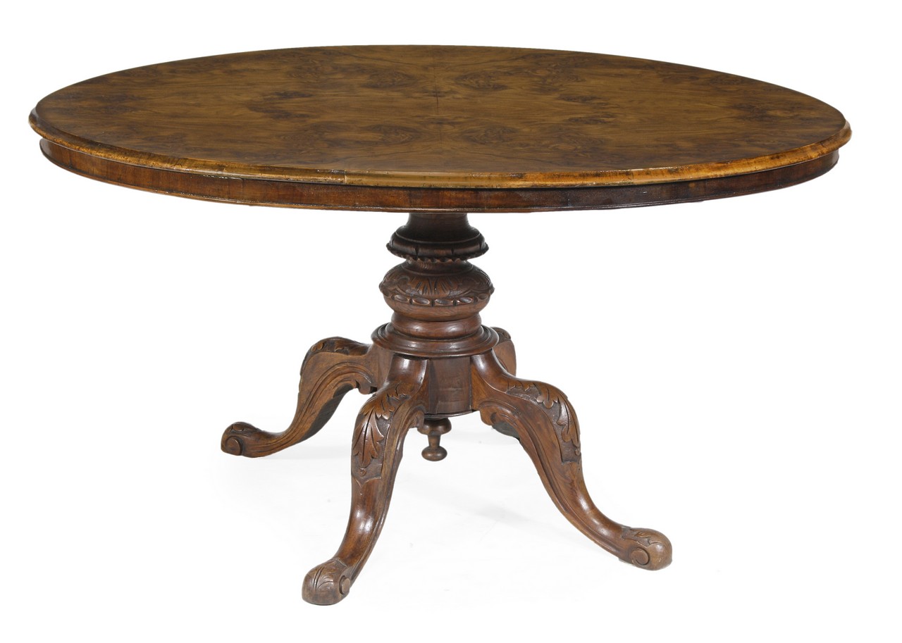 A Victorian walnut centre table, circa 1870, the oval top with moulded edge and frieze, above a