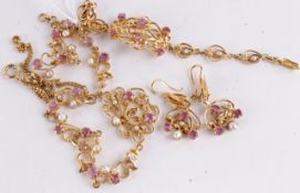 * A cultured pearl and ruby set suite of jewellery, comprising a necklace, bracelet and ear