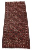 A Bokhara carpet, the crimson field decorated with lozenge medallions throughout, approximately