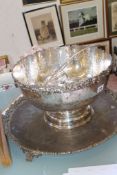 An electroplated and embossed punch bowl, mid to late 20th century; nine punch cups; a shaped