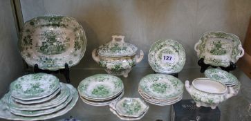 A Staffordshire pottery green printed child`s toy part dinner service. There is no condition