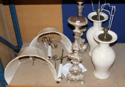 A pair of Italian silvered metal vari-baluster table candlesticks, 23in high; and a pair of baluster