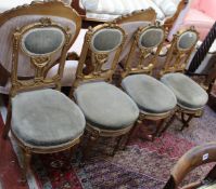 A set of four Louis XVI style giltwood chairs, a mahogany torchere and gilt decorated standard