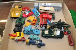 A collection of old Dinky cars, including a bulldozer, racing car, etc. There is no condition report