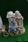 A Meissen (outside decorated) group, blue crossed swords and cancellation mark, incised E71; and a
