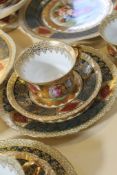 A Vienna style part tea service printed with classical subjects and a Limoges green-ground part