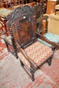 A 17th Century and later carved oak armchair There is no condition report available on this lot.