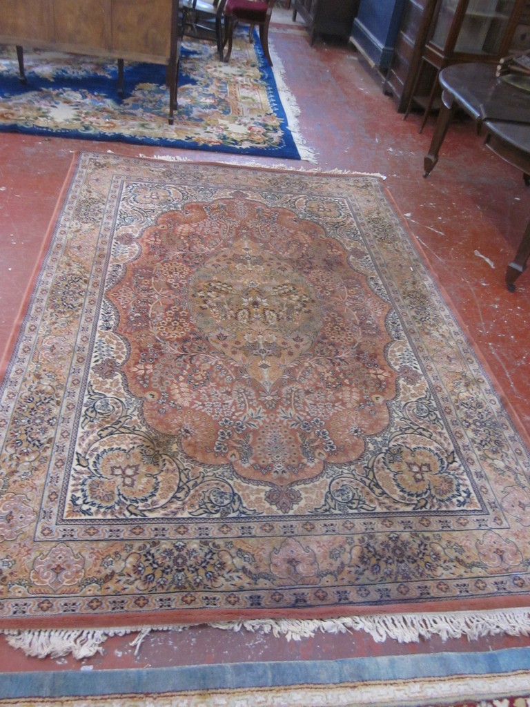 A Persian style rug with floral decoration 200x 300cm There is no condition report available on this