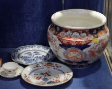 An Imari jardiniere, a Chinese blue and white vase, two Chinese plates, and a single cup and saucer,