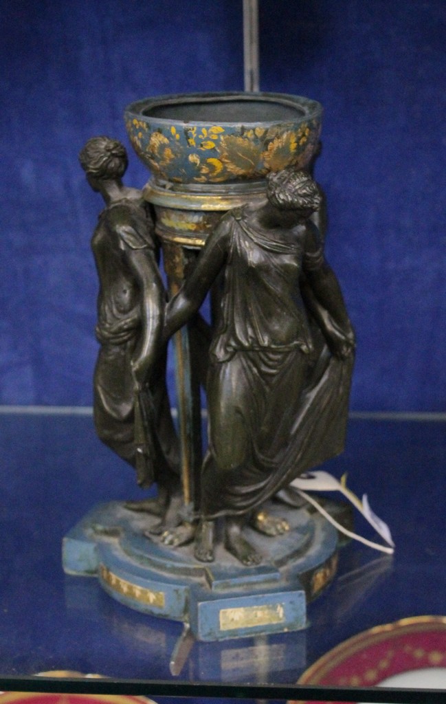 A `Three Graces` centrepiece, lacking cover (splits), 23cm high. There is no condition report