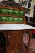 An Edwardian marble top wash stand with tiled back 93cm wide There is no condition report