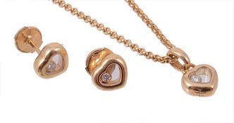 A Happy Diamonds heart shaped diamond pendant and matching ear studs by Chopard  A Happy Diamonds