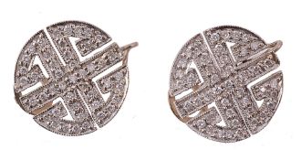 A pair of diamond ear clips, the circular pierced panel set throughout with...  A pair of diamond