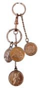 A key ring, with an attached 9 carat gold Saint Anthony charm; together with...  A key ring,