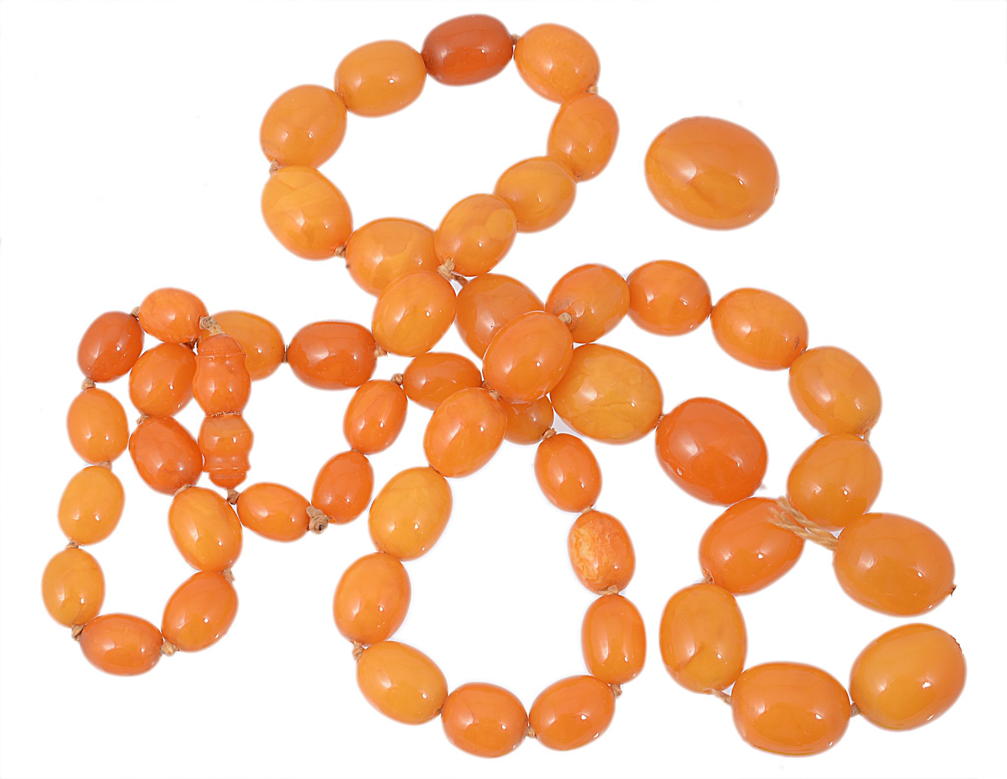 An amber bead necklace , composed of fifty one oval graduated beads  An amber bead necklace  ,