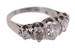 A diamond five stone ring, the central old brilliant cut diamond claw set...  A diamond five stone