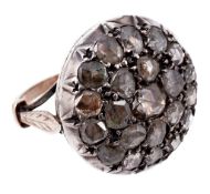 A diamond cluster ring, the circular panel pave set with rose cut diamonds  A diamond cluster ring,