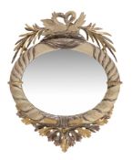 A painted and parcel gilt oval mirror, in the Regency style surmounted by swans 102cm high, 82cm